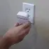 Esaver Watt being put in a socket